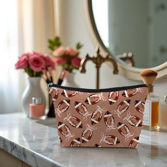 Coquette Pink Bow Football Makeup Bag, Football Lovers Gifts Cosmetic Bags for Women, Sports Player Fan Gifts Portable Travel Toiletry Bag Zipper Makeup Pouch